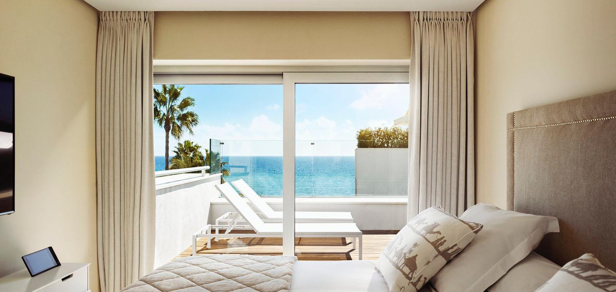 a lounger, positioned for the sea.