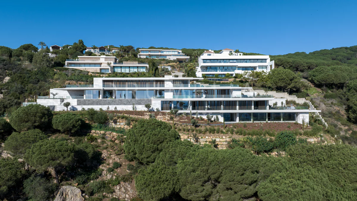 the exterior. Terraced into the hillside, sea just visible.