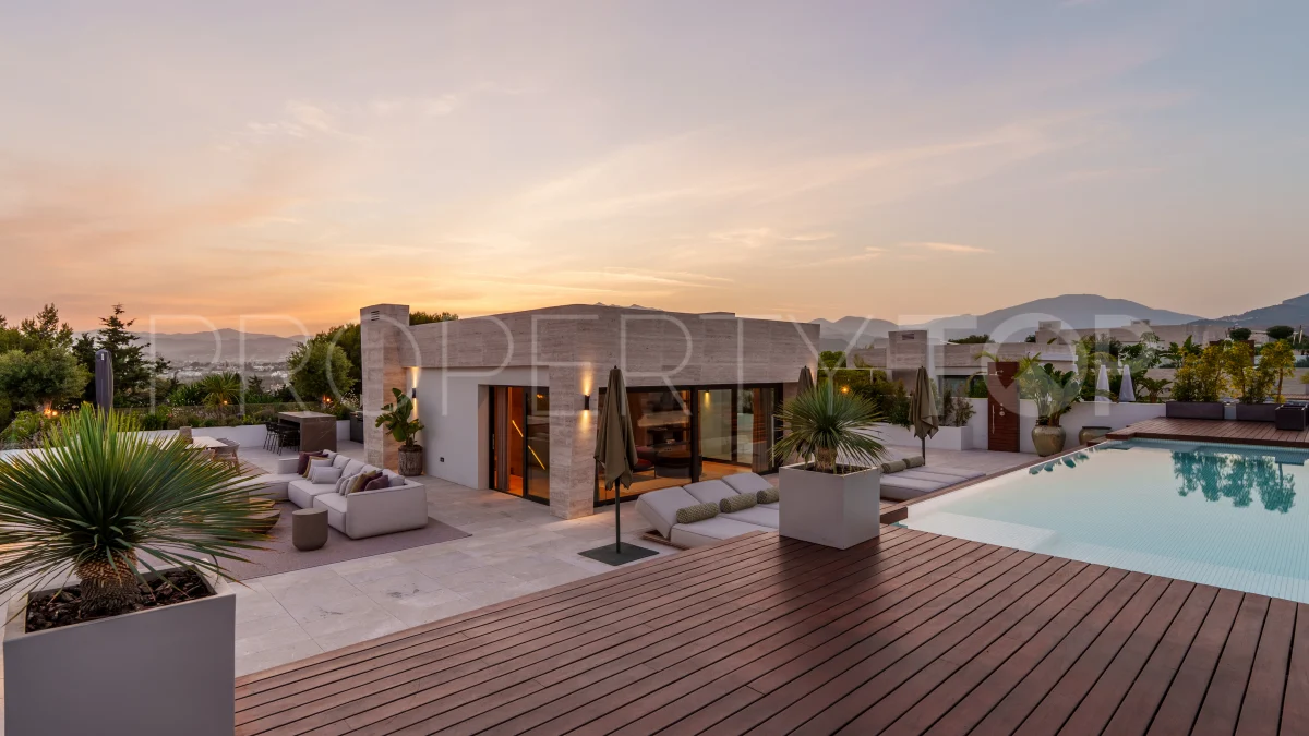 the terrace at dusk. It runs to 536 m², which is more than the apartment.