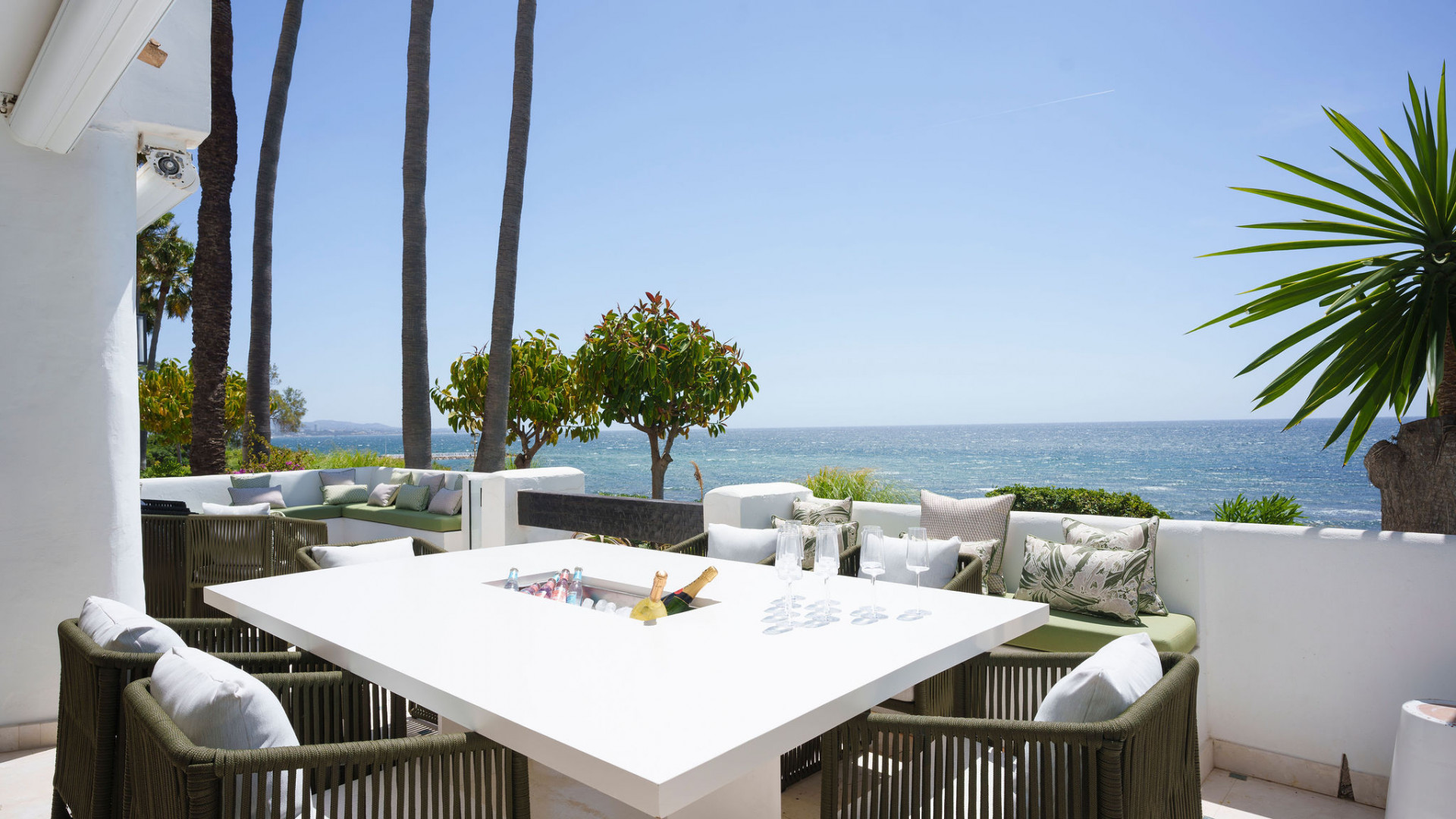 the terrace table, set for the frontline beach claim.